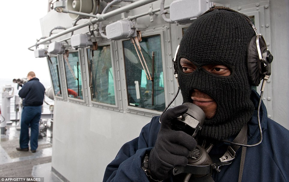 Forward look: Seaman Opoku calls out sightings on board the USS Wasp in the Atlantic Ocean